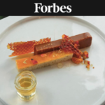 Beauty shot of The Wilde's honey dessert—pastry elements with honeycomb and honey drizzled on top